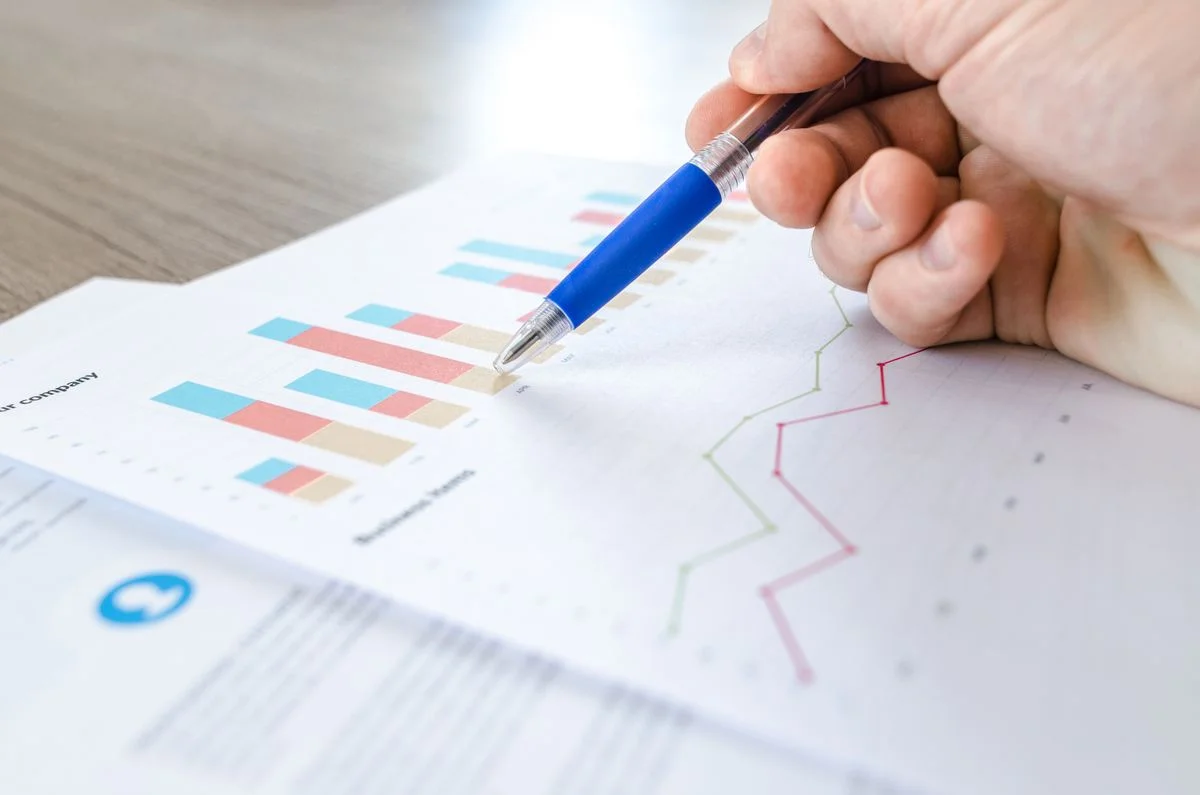 Research charts and data being reviewed on a desk